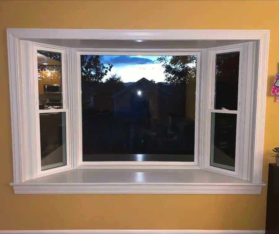 White bay window viewed from inside the home