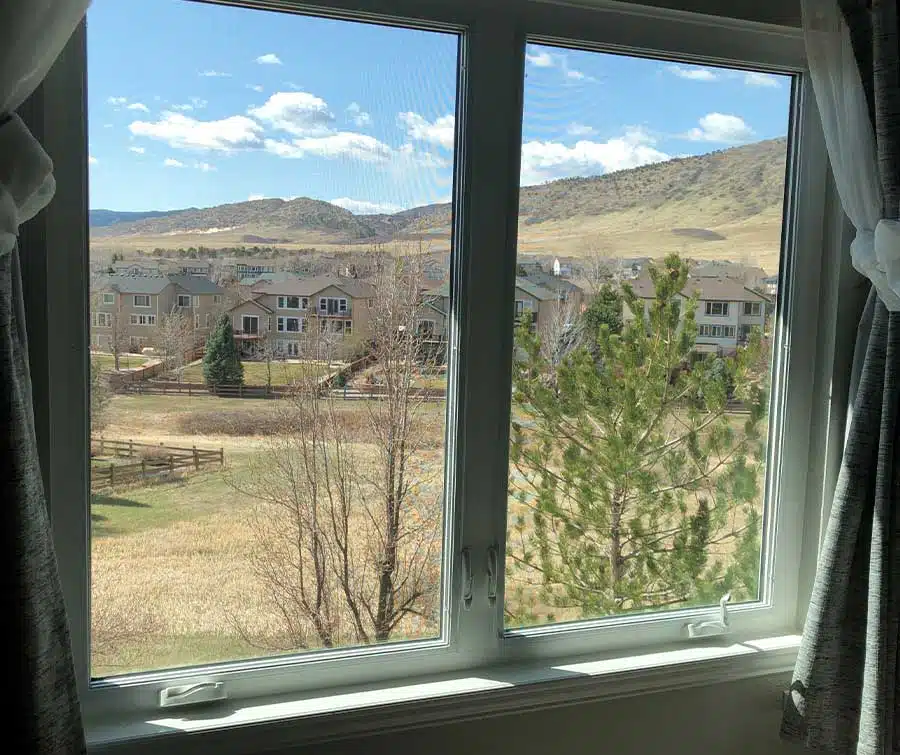 Casement windows overlooking a Colorado neighborhood