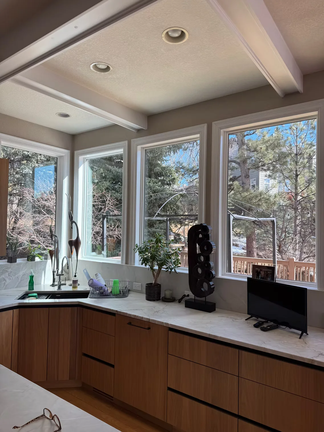 Kitchen with newly installed windows above the counter