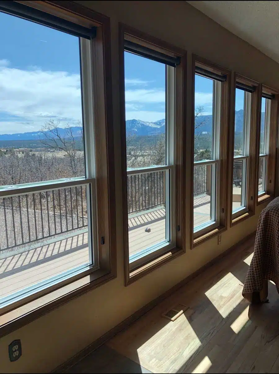 Row of double-hung windows overlooking Colorado mountains